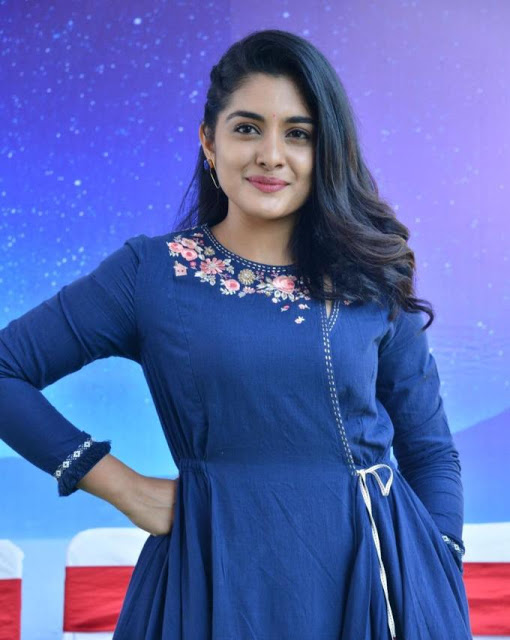 Nivetha Thomas Stills In Blue Dress At Tamil Movie Opening 9